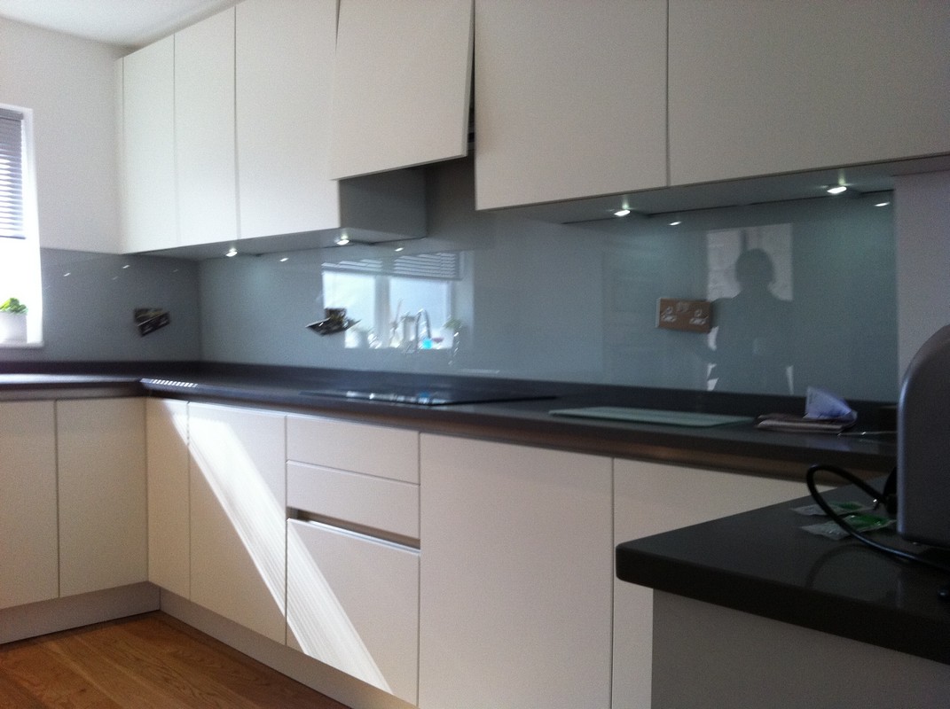Grey glass kitchen splashback with LED lighting in South Lambeth